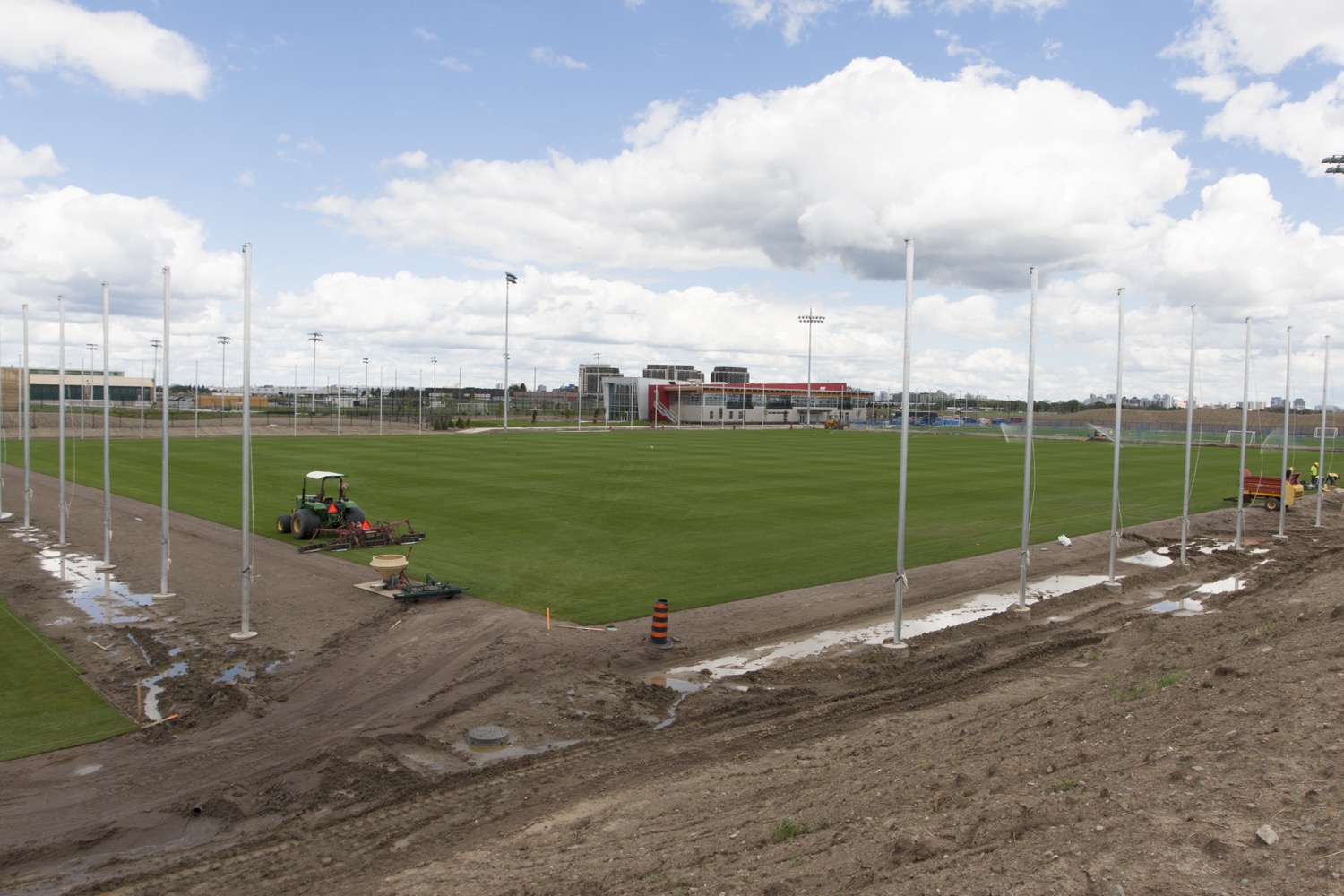 People at a concert facing the stage with various colours of paint powder in the air